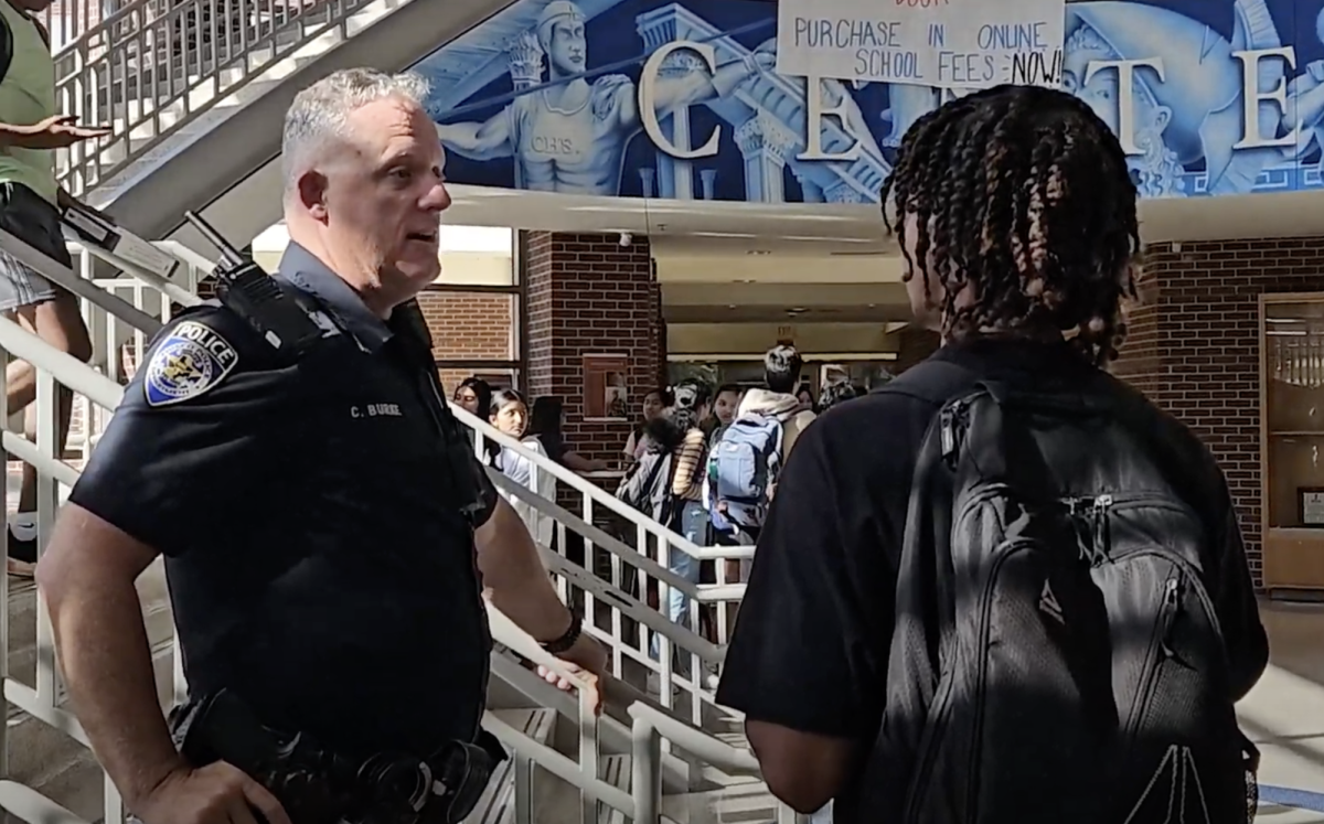 Officer Burke talking with student.